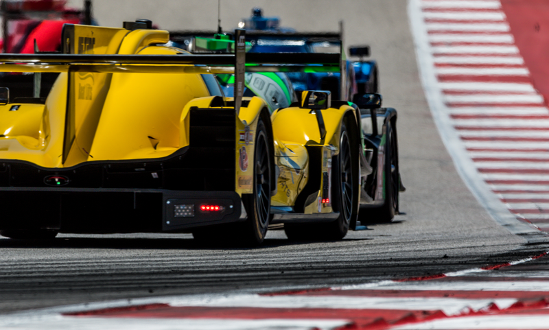 Look closely, and you can see the drivers’ helmets and faces in the mirrors.